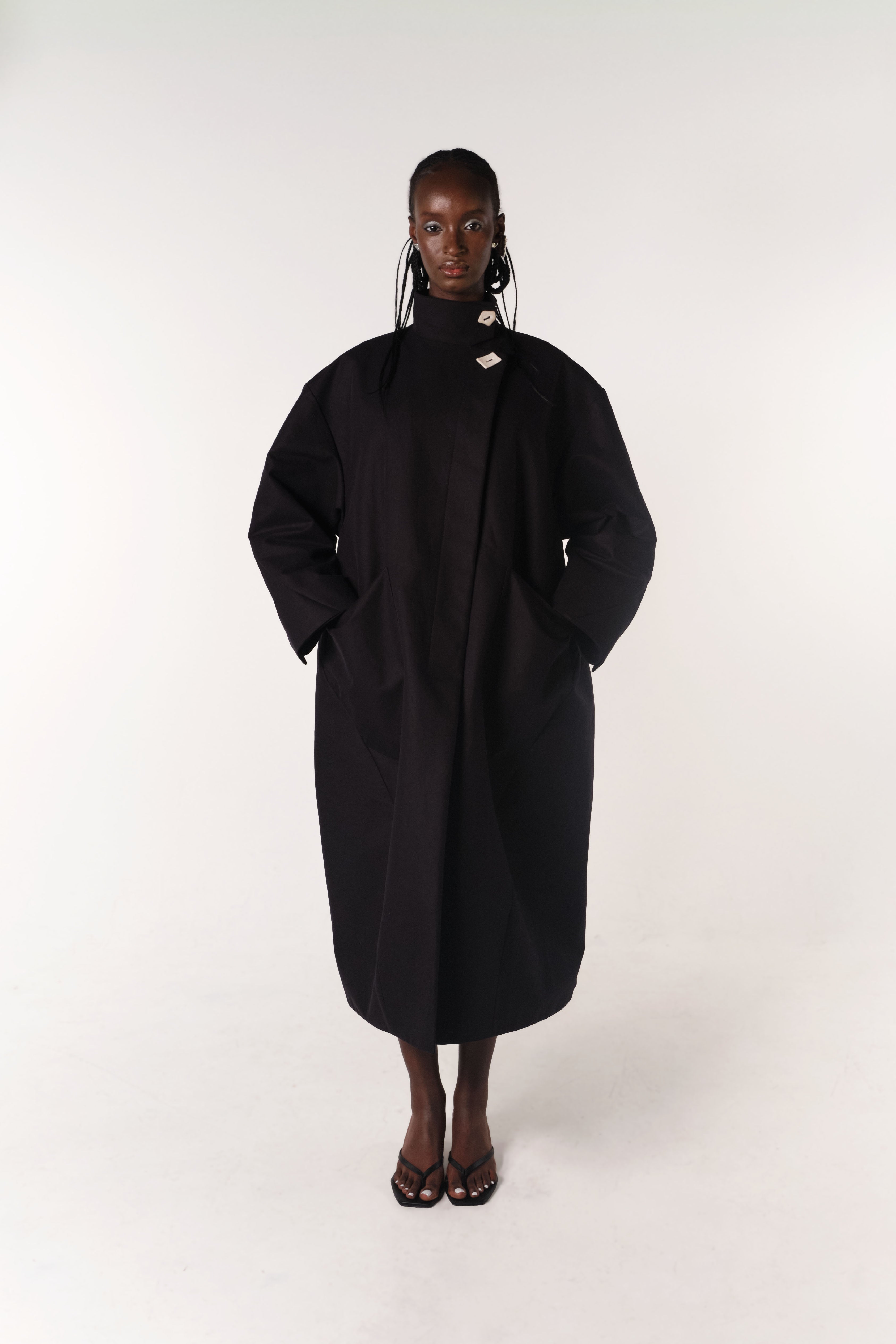BLACK HILDA COAT MADE FROM DEADSTOCK COTTON FABRIC ON MODEL CHLOE