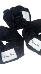 Black scrunchies with 'Moma Hilo' labels on a white background