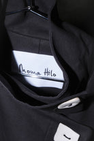 BRANDING CLOSE UP OF HILDA COAT IN BLACK